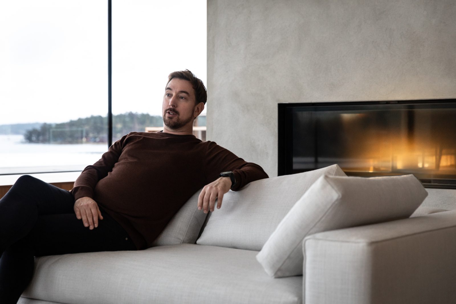 Man sitting in a grey sofa